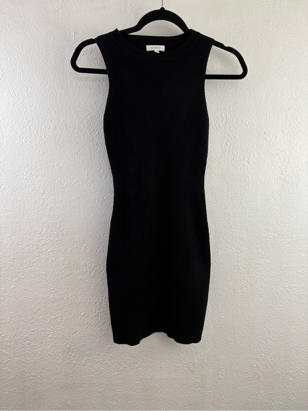 Better Be black ribbed knit mini dress crew neckline and a sleeveless design L